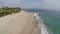 Flight and takeoff over seaside with waves. France, Corsica. Aerial view.