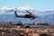 A flight of three Apache helicopters fly over Southern Utah