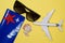 Flight tickets, sunglasses, airplane, star shell and small seashells