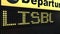 Flight to Lisbon on international airport departures board travelling to Portugal