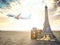 Flight to Paris, France.Vintage suiitcase with symbols of France Eiffel tower. Travel and tourism concept