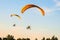 Flight of two motor paragliders trike skyward