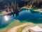 Flims lake at Switzerland drone aerial, alpine mountains, sunny, summer landscape, blue water