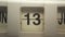 The flip clock changing the number from 13 to 13