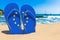 Flip flops with The EU flag on the beach. the European Union resorts, vacation, tours, travel packages concept. 3D rendering