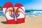 Flip flops with French Polynesian flag on the beach. French Polynesia resorts, vacation, tours, travel packages concept. 3D