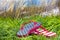 Flip flops in grass at beach