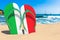 Flip flops with Italian flag on the beach. Italy resorts, vacation, tours, travel packages concept. 3D rendering