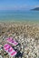 Flip flops on pebbled beach