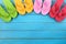 Flip flops in a row, summer background border, copy space