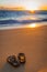 Flip-flops (slippers) on a tropical beach at sunset