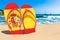 Flip flops with Spanish flag on the beach. Spain resorts, vacation, tours, travel packages concept. 3D rendering