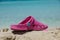 Flip-flops on a sunny pile of sand . beach slipper on the beach