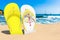 Flip flops with Vatican flag on the beach. Vatican resorts, vacation, tours, travel packages concept. 3D rendering