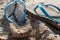 Flipflop sandals on the beach in a sand, travelling and resort concept