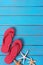 Flipflops starfish summer seashore blue wood background vertical