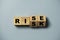 Flipping of wooden cube block between rise and risk for risk analysis assessment and management concept