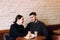 Flirting in a cafe. Beautiful loving couple sitting in cafe