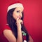 Flirting coquette woman in santa claus christmas costume looking