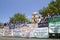 Float of a Little League baseball team with sponsor advertisements makes its way down main street during a Fourth of July parade