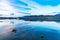 Float plane and yacht on calm lake Te Anau before sunrise