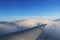 Floating Aeroplane wing above the Clouds