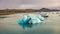 Floating of blue icebergs in Jokulsarlon Glacier Lagoon. Impressive summer sunrise on Vatnajokull National Park. Picturesque morni