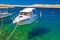 Floating boat on turquoise sea in Velebit channel