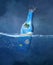 Floating bottle in the blue sea