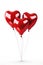 A floating bouquet of red heart shaped balloons on a white background.