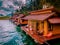 Floating bungalows at Khao Sok Thailand, drone view at the lake with couple in front of bungalow