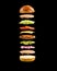 Floating burger ingredients on the black background