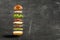 Floating burger ingredients on the grey background