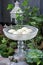 Floating candles in crystal bowl. Beautiful garden decoration