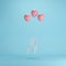 Floating Chair with pink balloons on blue background.