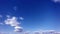 Floating clouds in blue sky 4k timelapse