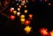 Floating colored lanterns and garlands on river at night on Vesak day for celebrating Buddha\'s birthday in Eastern culture, that