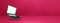 Floating computer laptop isolated on pink. Horizontal banner background