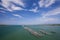 A Floating fish farm in sea under clear sky