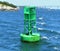 Floating Green Buoy in Atlantic Ocean