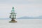 Floating green navigational buoy on sea,gulf of Thailand.