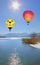 Floating hot air balloons over lake tegernsee, germany