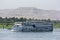 A floating hotel moves along the River Nile in Egypt from Luxor towards the Esna Lock.