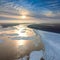 Floating ice floes are drifting on the great river