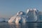 Floating icebergs in Disko Bay during the midnight sun