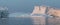 Floating icebergs in Disko Bay during the midnight sun