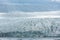 Floating icebergs melting in Fjallsarlon glacier lake, Iceland
