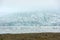 Floating icebergs melting in Fjallsarlon glacier lake, Iceland