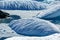 Floating icebergs stranded on beach of Petermann Island, Antarctica