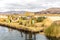 Floating Islands on Lake Titicaca Puno, Peru, South America, thatched home.